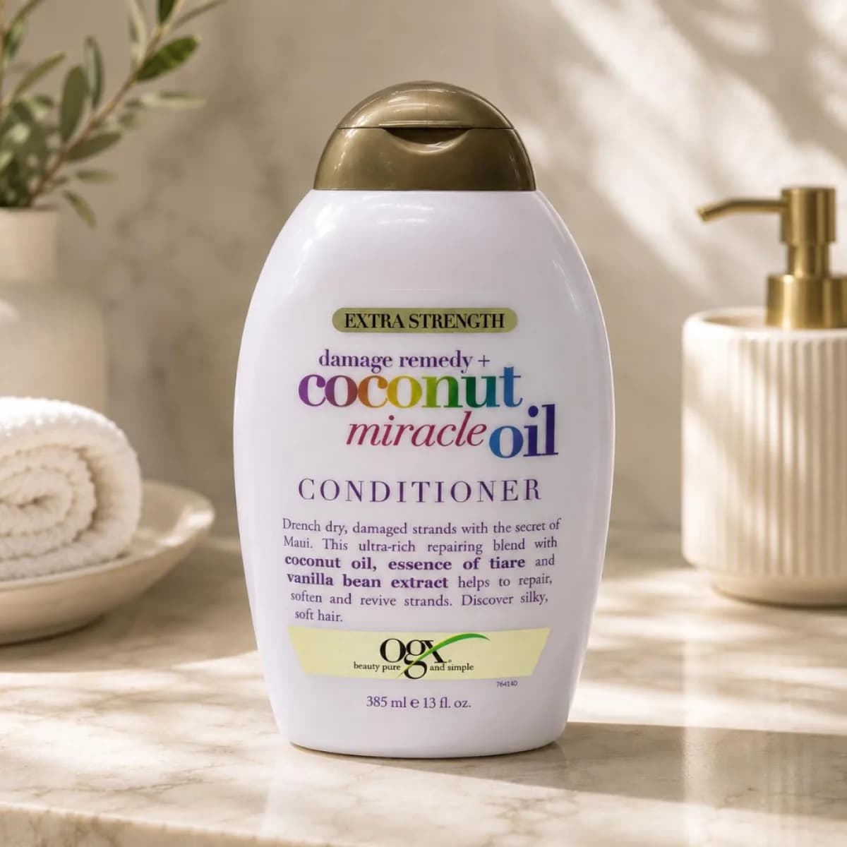 Extra Strength Damage Remedy + Coconut Miracle Oil Conditioner bottle